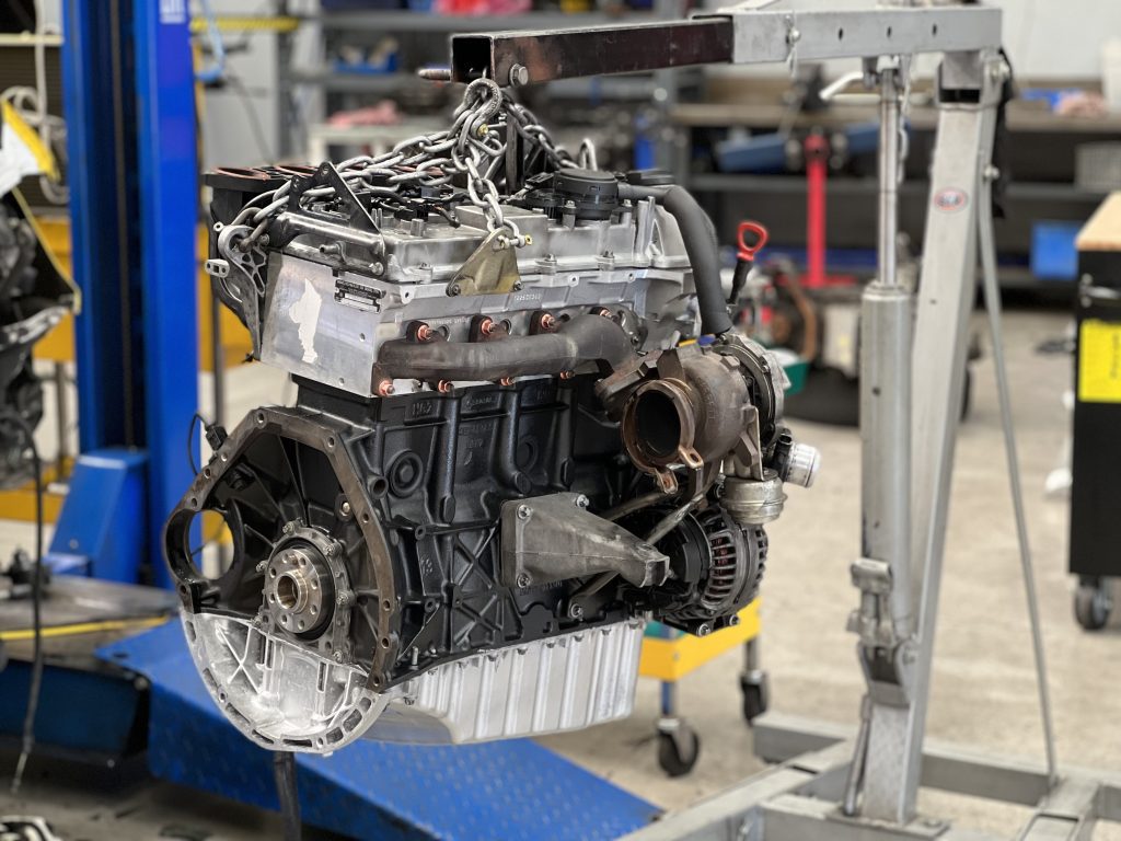 rebuilt mercedes sprinter diesel engine on engine crane