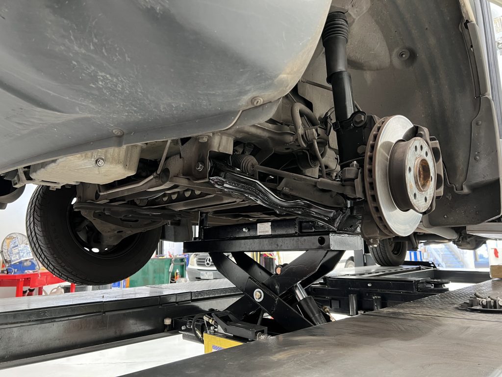 mercedes sprinter on hoist having suspension and steering repairs completed